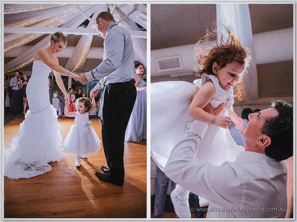 Sarah spins the flower girl across the dance floor before a groomsman tosses her skyward