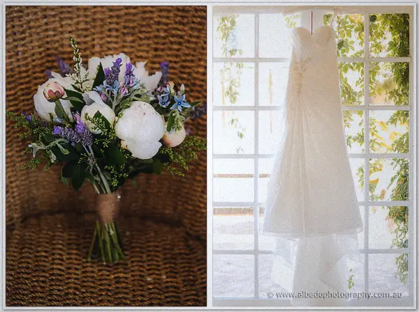 A lavender and peony bouquet rests on wicker beside Ashley's strapless gown hung in a sunlit window