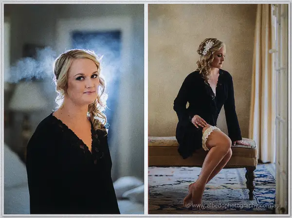 Ashley wears a black lace robe, framed by morning mist, then perches on a bench fastening ivory garters
