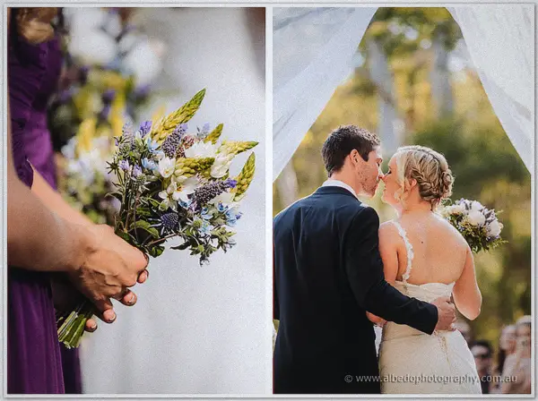 Purple and white bridal bouquet held beside a bridesmaid and the newlyweds kissing
