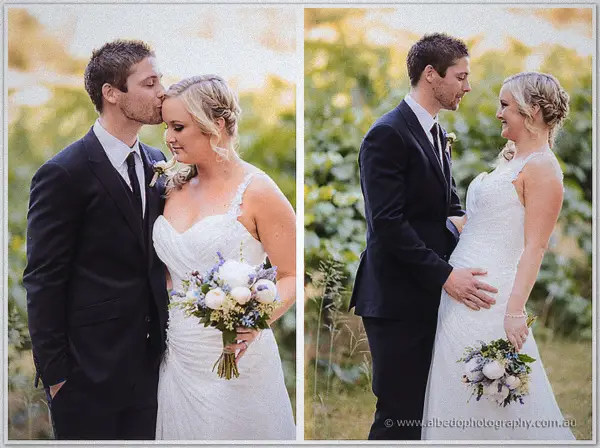 Groom kissing his bride's temple between two vineyard portraits