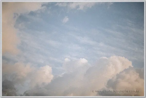 Soft morning clouds drift across a pale blue sky above the Swan Valley estate
