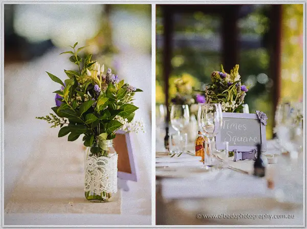 Twin close-ups of lace-wrapped wildflower jars and a Times Square table sign on the reception tables