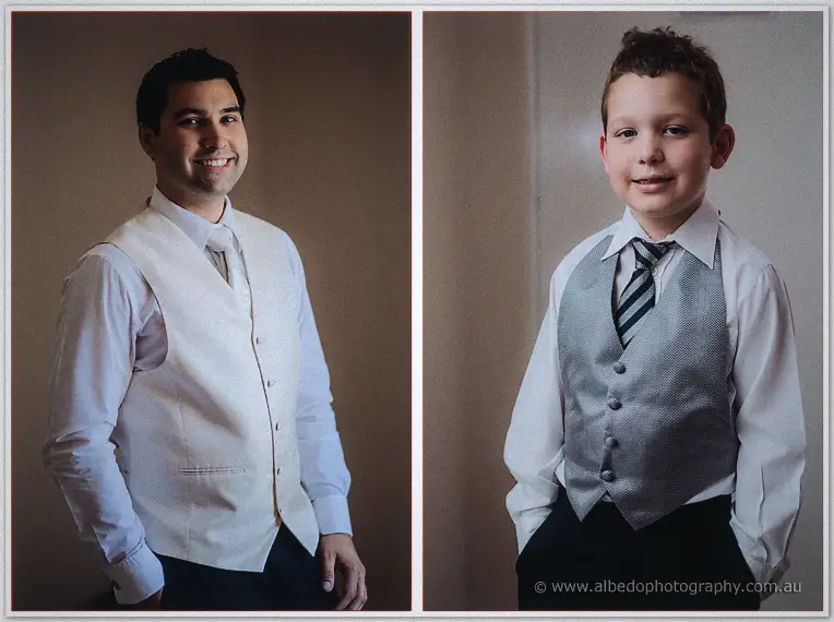 Smiling portrait pairing of Craig in a cream vest and the page boy in a grey vest and striped tie