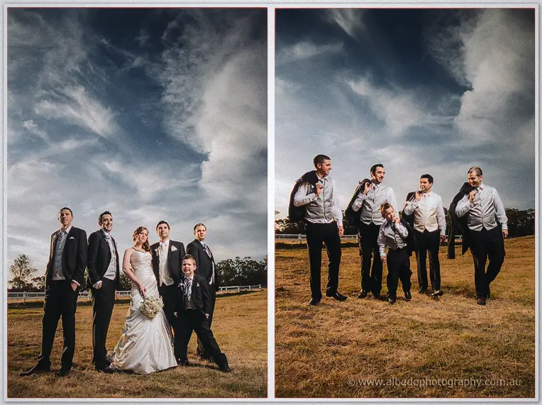 The bridal party line up under a moody sky before the groomsmen stroll off with jackets over their shoulders