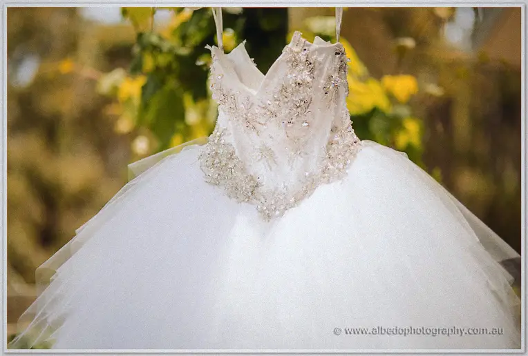 Close-up of the gown's beaded sweetheart bodice, crystals glittering against soft tulle layers