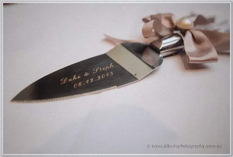 Engraved cake server reading Luke and Steph 06.12.2013, finished with satin ribbon