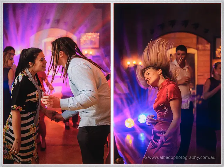 Guests laugh and dance as a woman flips her hair back under purple party lights