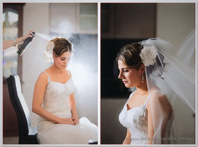Hairspray mists Elena's floral-pinned updo, then her veiled profile in the finished gown