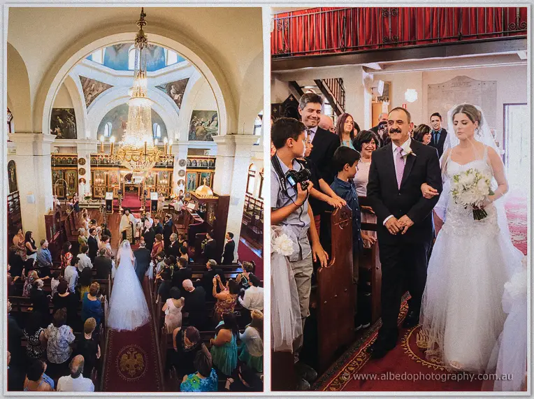 Veiled Elena walks the aisle toward the chandelier, then on her father's arm past smiling guests