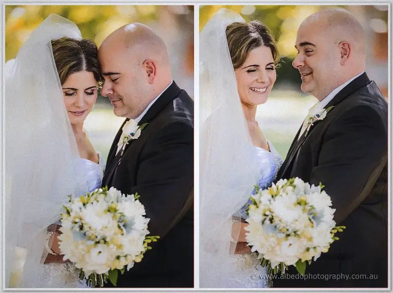 Elena and James touch foreheads beneath her flowing veil, eyes closed in a quiet garden moment
