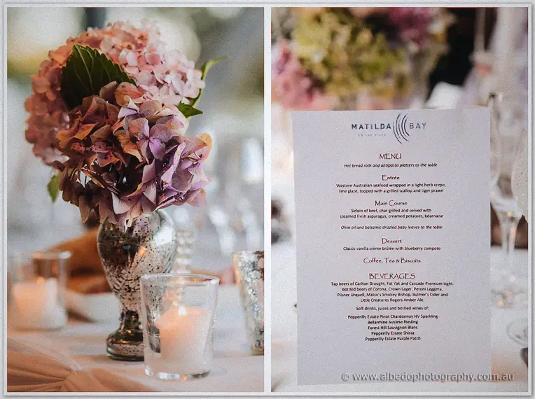 A mercury-glass vase of lilac hydrangeas beside a lit candle and the printed Matilda Bay wedding menu