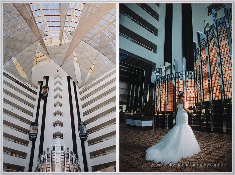 Haley's train spreads across the atrium floor of a curved Perth hotel tower under a glass skylight