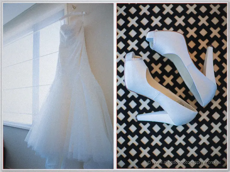 Haley's lace and tulle gown hangs in window light beside her white peep-toe heels