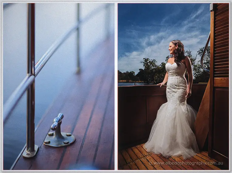 Haley's lace mermaid gown spreads across the cruiser's deck beneath a vivid blue river sky