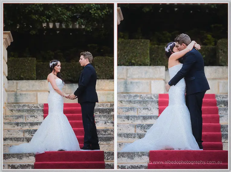 Haley and Matt hold hands then share their first kiss on the ceremony steps at dusk