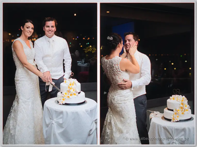 The couple cut their frangipani-topped cake, then Stacey cradles Nathain's face for a kiss.