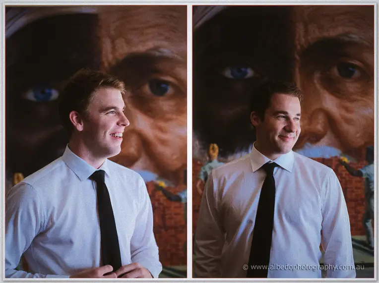 Groomsmen portraits side by side, black ties and white shirts, in front of a mural of an old man's face