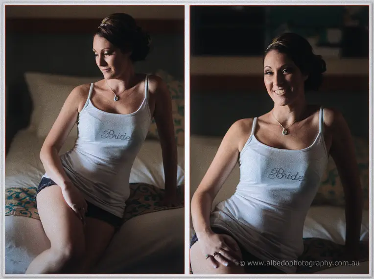 Elisha lounges on the bed in her sparkling Bride tank, laughing in soft window light.