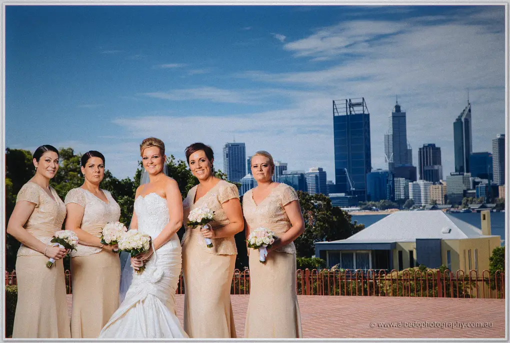 Kristina flanked by her four bridesmaids, Perth's towers and river spread out behind them