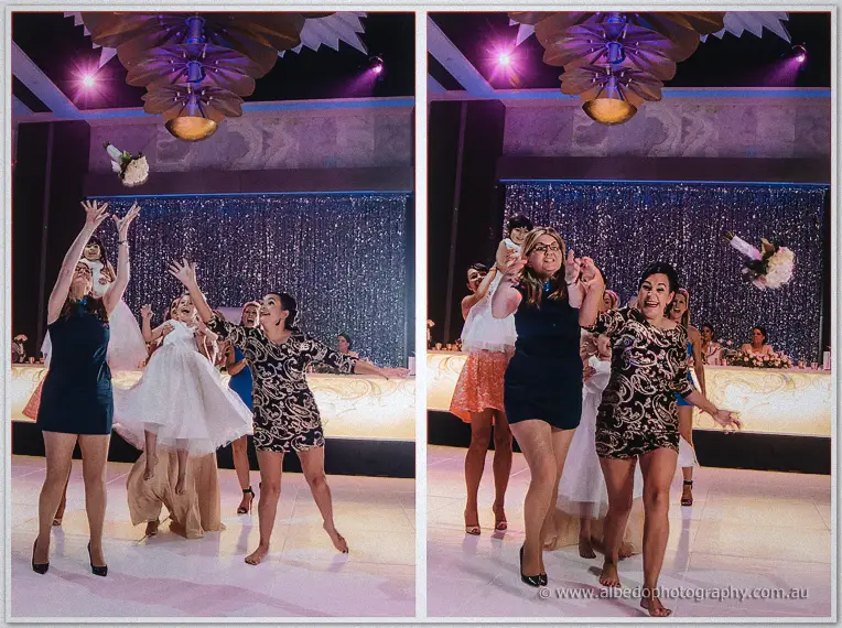 Excited women leap and stretch to catch Kristina's tossed bouquet on the Astral Ballroom dance floor.