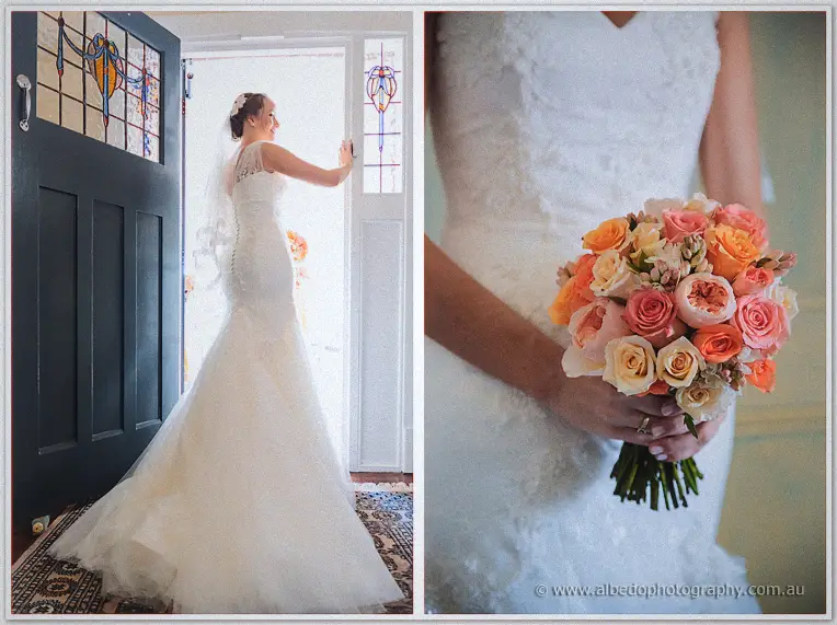 Katelyn opens a leadlight door in her lace gown beside a peach bridal bouquet