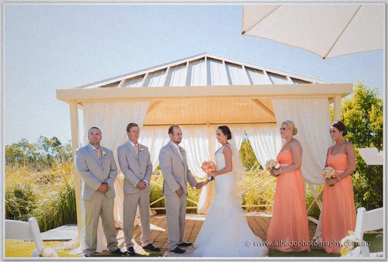 Katelyn and Matt exchange vows in the lakeside gazebo at Brookleigh