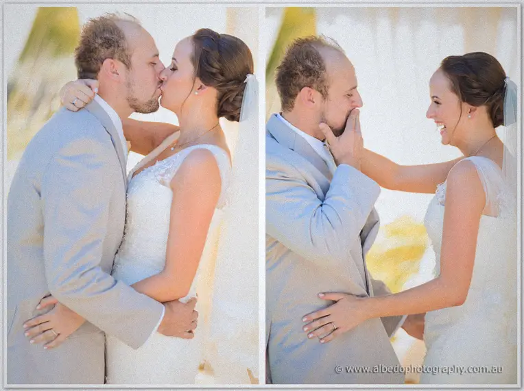 Katelyn kisses Matt then playfully wipes his cheek at the arbour