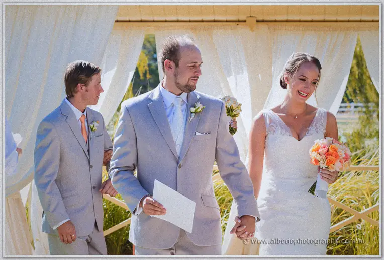Katelyn and Matt walk hand in hand back down the aisle as husband and wife