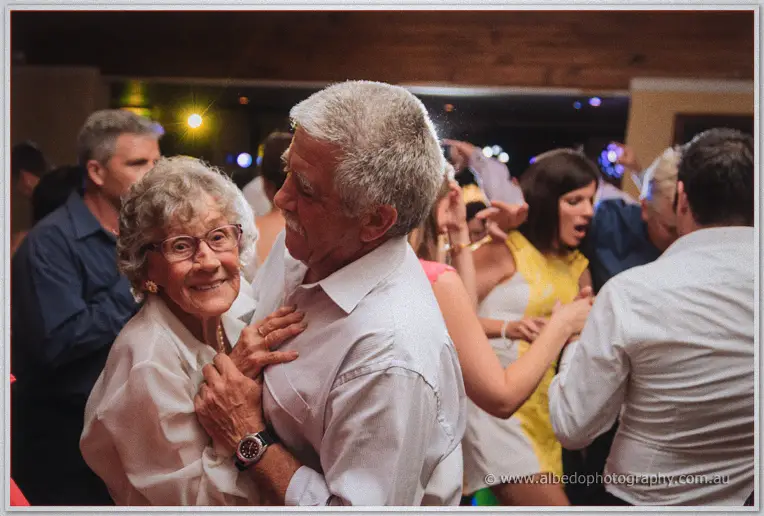 An elderly couple embraces on the packed Brookleigh dance floor as guests party behind