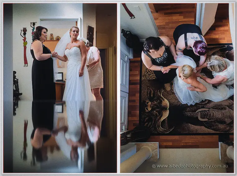 Teigan's helpers lace her dress on the stairs while she waits in gown beside her maid of honour