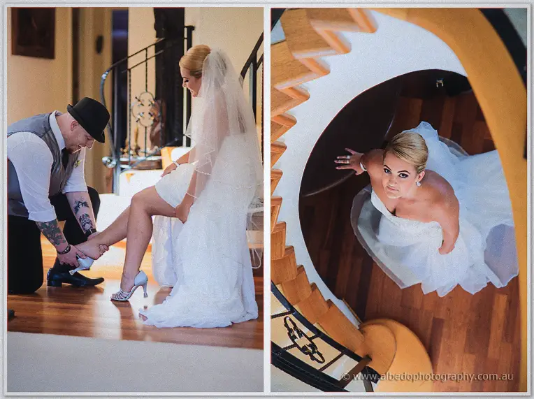 Troy kneels to clasp Teigan's shoe as she lifts her gown, then Teigan looks up a spiral staircase