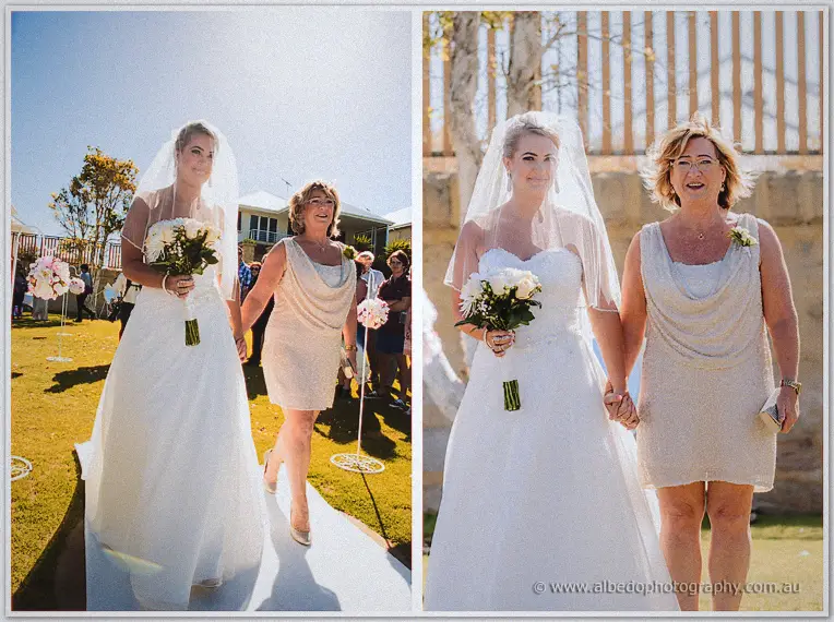 Teigan walks the garden aisle hand in hand with her smiling mother in a champagne dress