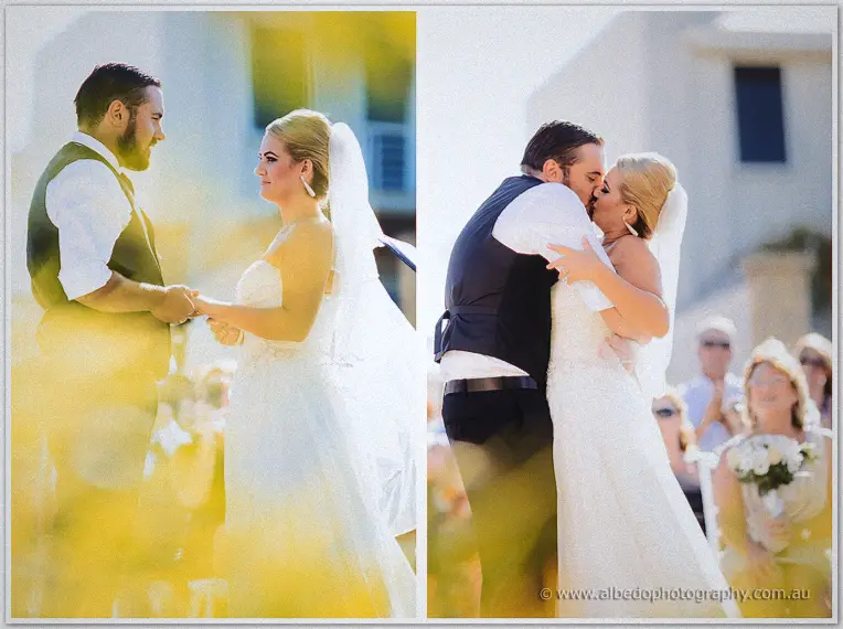 Troy dips Teigan into their first kiss as guests applaud in golden flare
