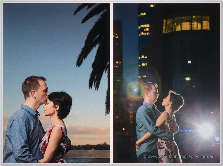 Alex kisses Loan's forehead beneath a palm at dusk, then the pair embrace in glowing city light