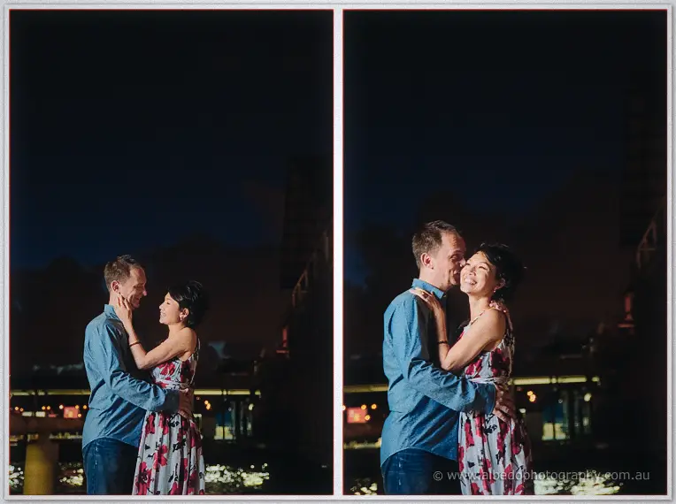 Loan and Alex hug and laugh beneath the night lights of the harbor ferris wheel