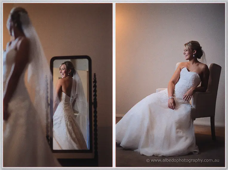 Lauren laughs at her reflection in a tall mirror and relaxes on an armchair in her gown