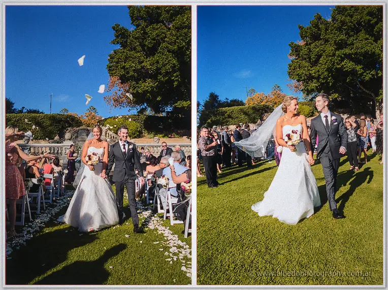 Petals rain over Lauren and Ryan as they leave arm in arm across the sunlit lawn
