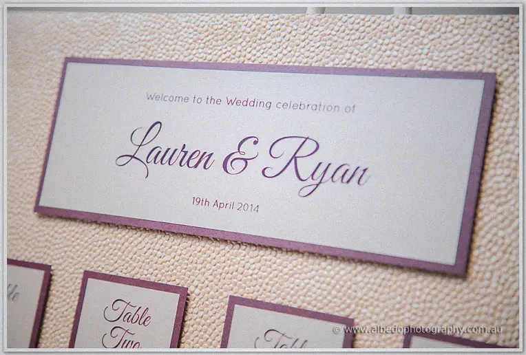 Close-up of the wedding seating chart card reading Lauren and Ryan's 19th April 2014 celebration