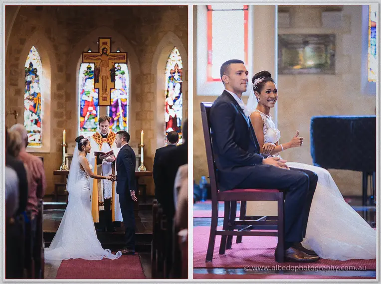 The couple join hands before the priest beneath the crucifix, then smile from ceremonial chairs in church.