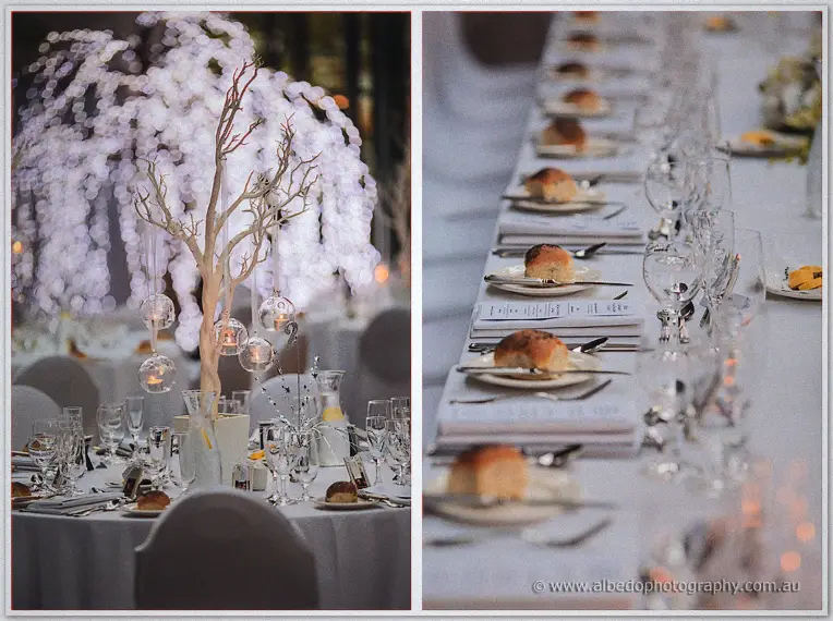 A twin frame pairs the fairy-lit canopy with a long table set with rolls and gleaming glassware.