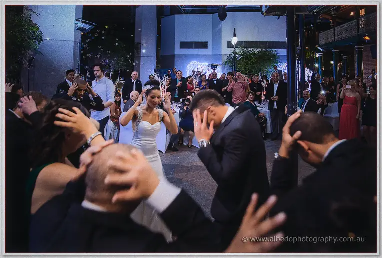 A bubble shower sends Cristal and her guests ducking and laughing across the courtyard floor.