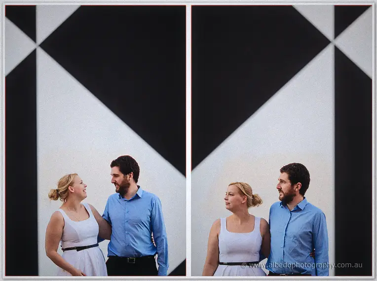 Two portraits of Julie and Dale grinning at each other in front of a black and white mural