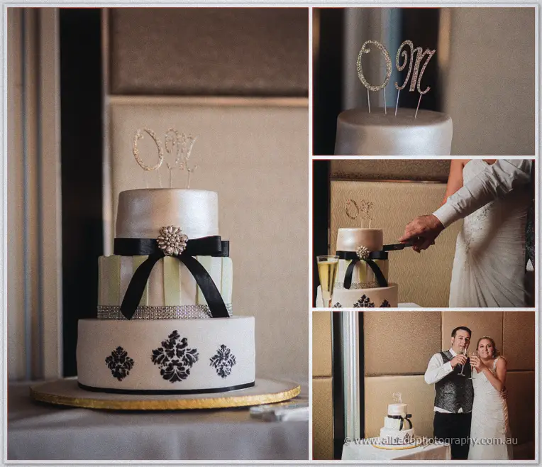 Olivia and Max cut their three-tier black ribbon cake topped with sparkling OM monogram letters.