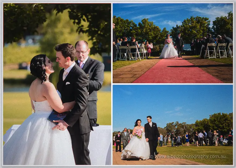Chris kisses his bride beside the lake as guests applaud and the couple walk back up the red carpet aisle.