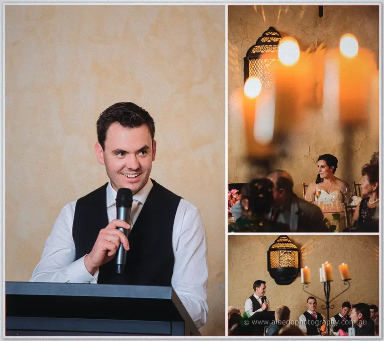 Chris grins through his speech at the lectern as Sarah listens amid candlelight and glowing lanterns.