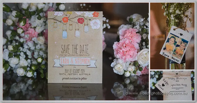 A kraft-paper save the date card for Tara and Stephen sits among pink carnations and photo tags