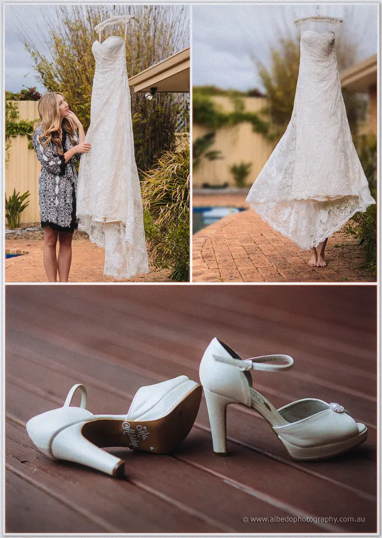 Family lift and cuddle the baby flower girl in her white tulle dress across a warm indoor collage