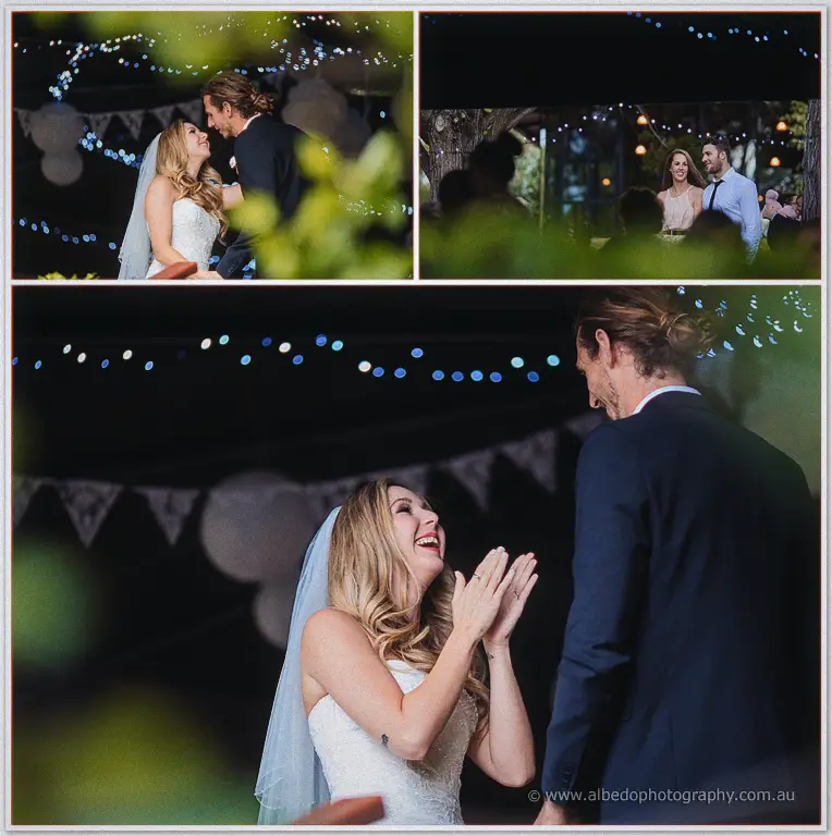 Under strings of fairy lights at night, Tara laughs and claps as Stephen stands close during the reception