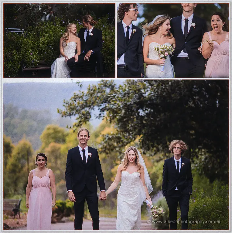 Tara and Stephen stroll the garden path flanked by their bridesmaid in pink and groomsman in navy
